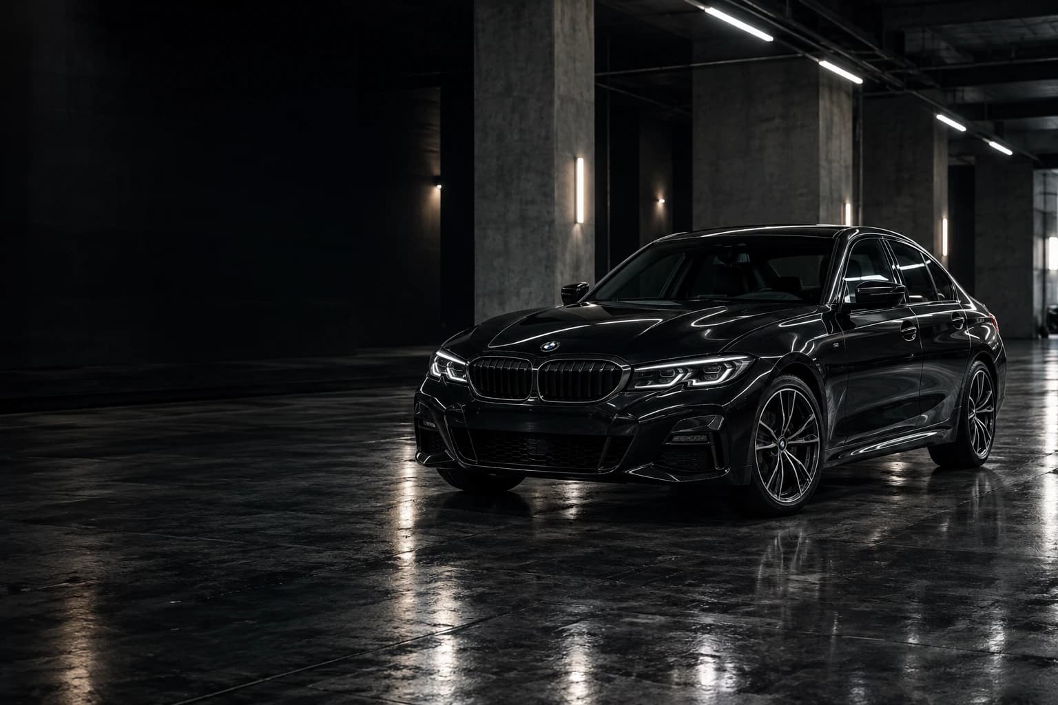 Black sport sedan in a premium automotive showroom