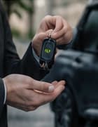 Car keys being handed to a rental customer